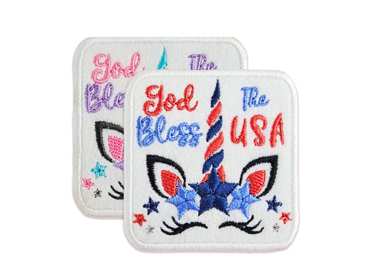 Two versions of the God Bless The USA unicorn patch: one in classic red, white, and blue, and one in soft pastel colors.