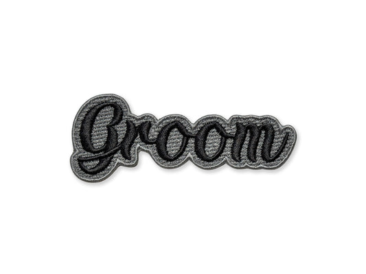 Embroidered patch with 'Groom' text on a white background