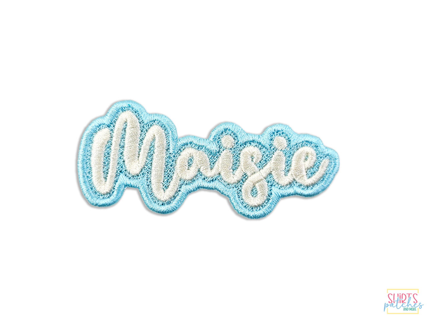 Embroidered patch with the name 'Maisie' in white text on a blue background