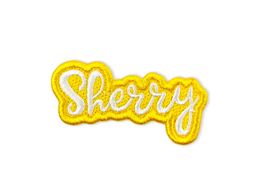 Embroidered name patch with 'Sherry' in script, featuring white lettering and a bright yellow embroidered border on a white background. - Shirts Patches And More