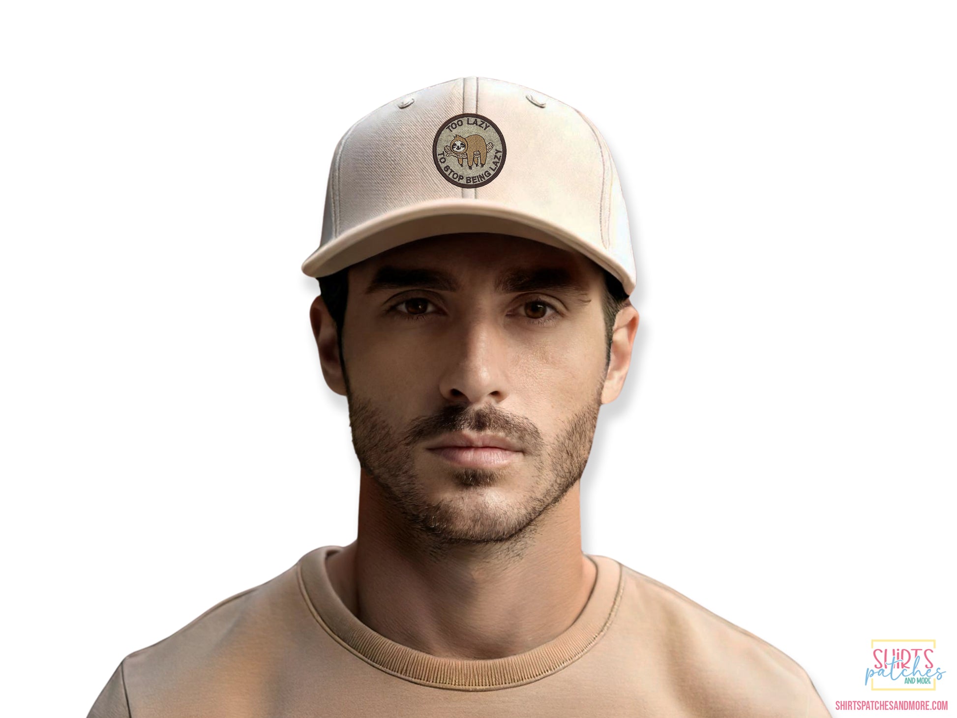 Lifestyle shot of a man wearing a beige baseball cap featuring the "Too Lazy to Stop Being Lazy" sloth patch, demonstrating the patch size and fit on headwear.