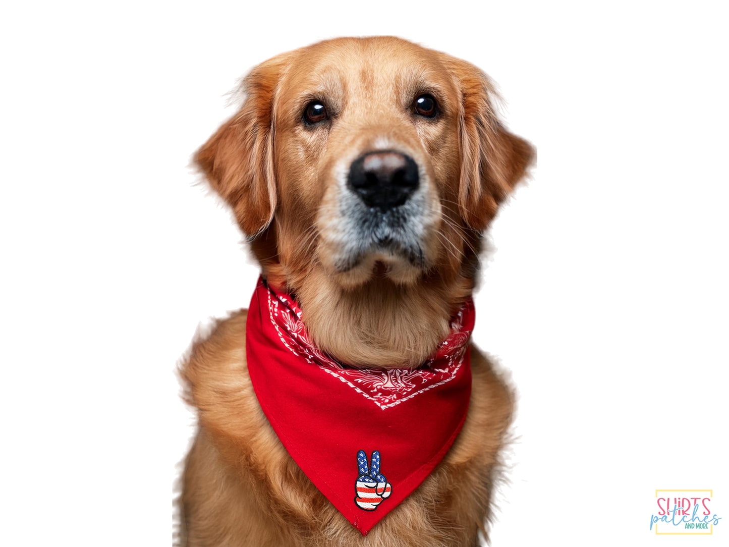 Golden Retriever dog wearing a red bandana with a hand-embroidered USA flag peace sign patch on a white background.