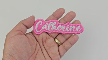 Video showing a close-up of the Catherine embroidered name patch held in hand and rotated to display stitching and details.